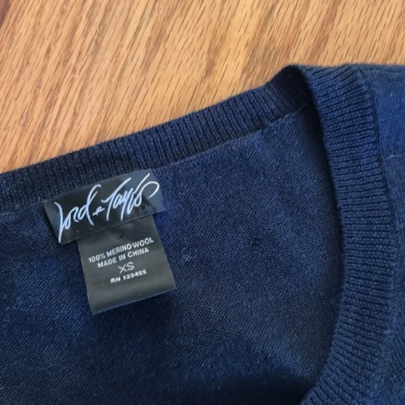 Navy blue merino wool Lord & Taylor cardigan sweater with black bow snap detail - Picture 3 of 3